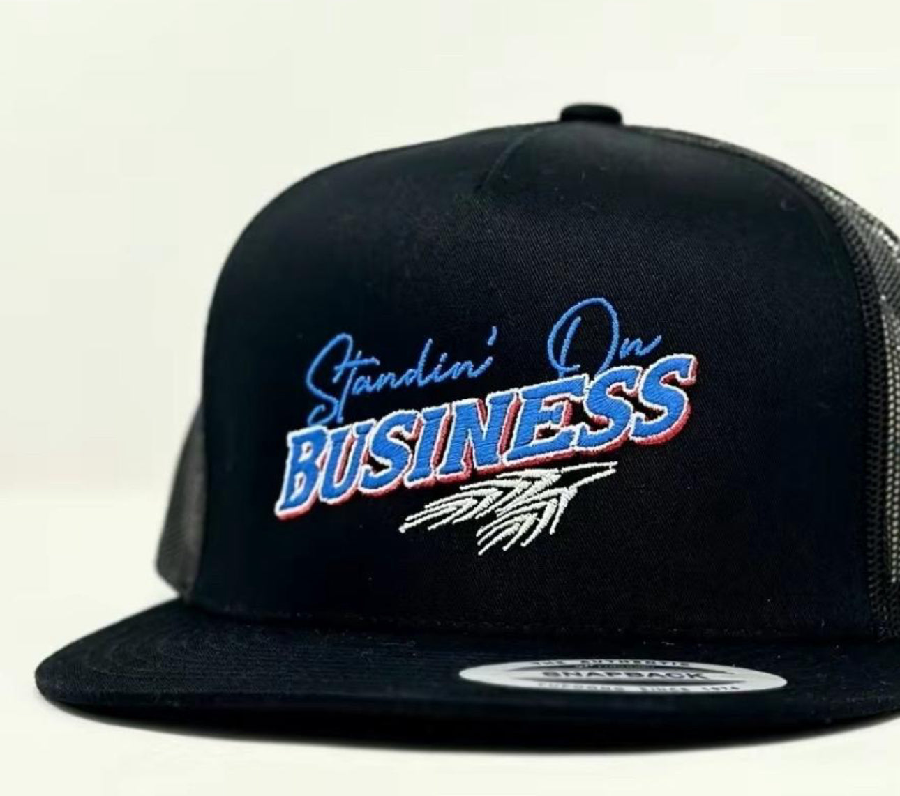 Standing on business trucker hat