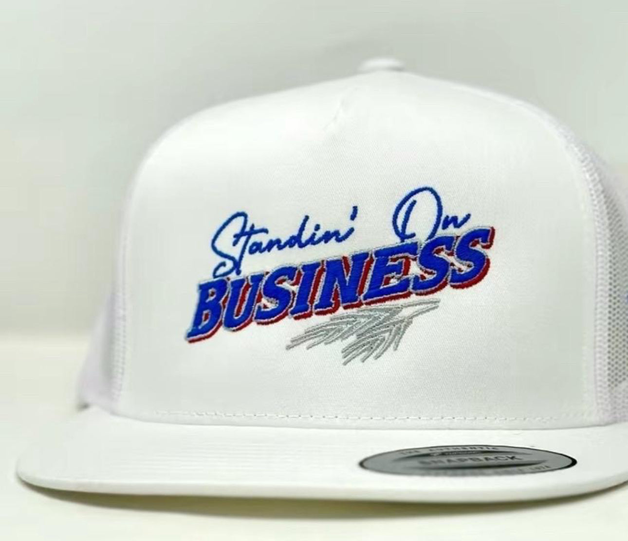 Standing on business trucker hat