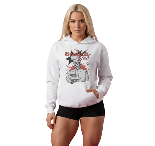 Woman wearing a white hoodie with 'The Brunch Club' design on a pink background
